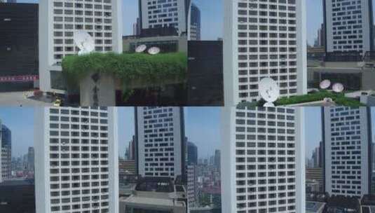 城市航拍南京金陵饭店地面石碑升到顶部LOGO高清在线视频素材下载