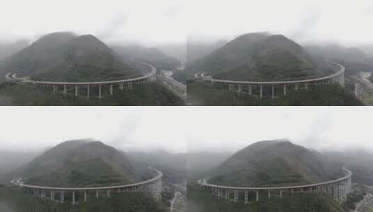4K航拍四川雅西高速大山云雾双螺旋大桥高清在线视频素材下载