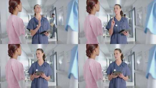 白人护士在医院走廊上与护士交谈高清在线视频素材下载