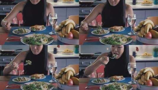 girl-eating-salad-in-her-kitchen高清在线视频素材下载