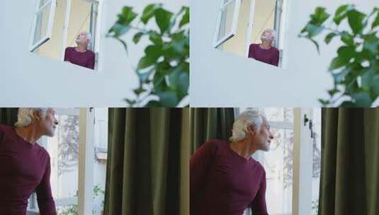 白发老人窗边眺望高清在线视频素材下载