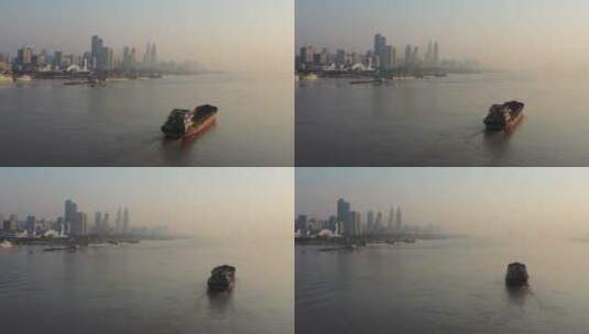 武汉江滩航拍江面船航行江岸码头高楼大厦高清在线视频素材下载