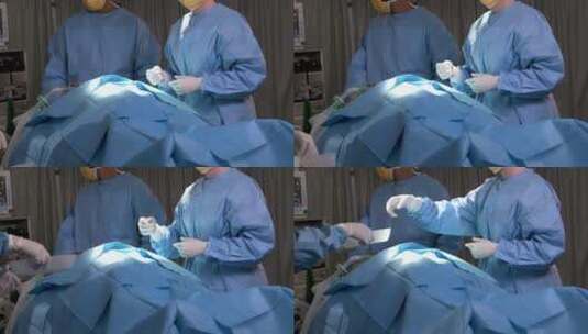 外科医生从助手那里拿走手术器械高清在线视频素材下载