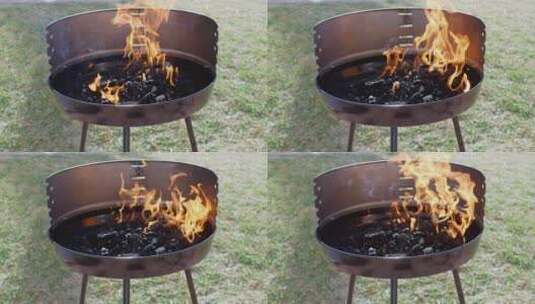 便携式烧烤架上的火焰高清在线视频素材下载