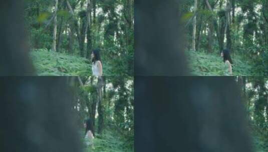 穿白色长裙的女孩在森林行走的背影视频高清在线视频素材下载