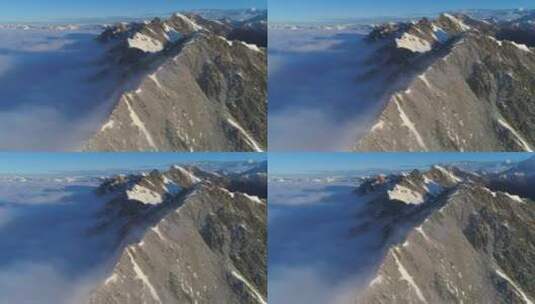 平移航拍云雾缭绕的巴郎山雪山素材高清在线视频素材下载