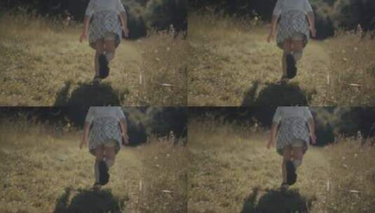 草地上奔跑的小女孩高清在线视频素材下载