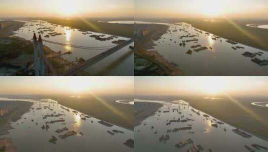 4K航拍夕阳下的洞庭湖桥长江入江口货轮2高清在线视频素材下载