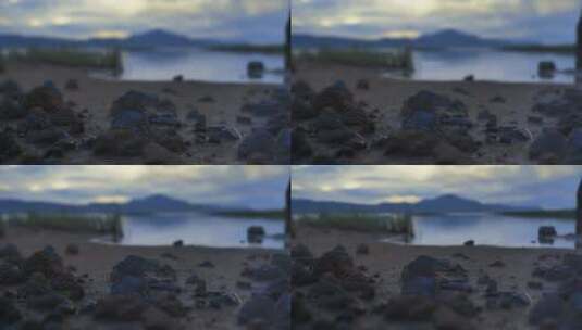 平静的湖岸，有沙、草和岩石高清在线视频素材下载