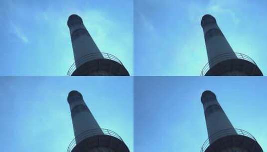 蓝天下工厂烟囱酒厂烟囱排放空气污染环保高清在线视频素材下载