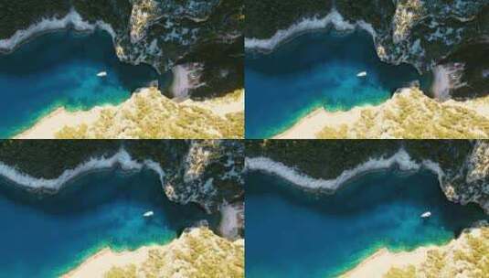 航拍小船蓝色大海森林绿树海湾海岛克罗地亚高清在线视频素材下载