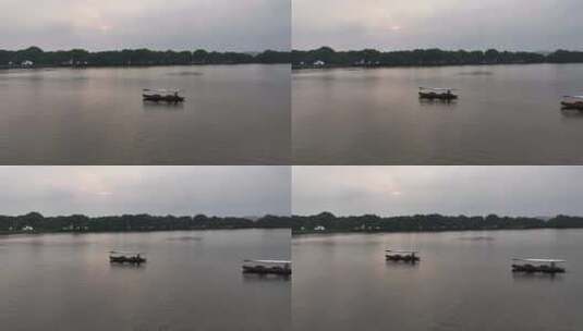 俯拍杭州西湖摇橹船 手划船 泛舟湖上高清在线视频素材下载