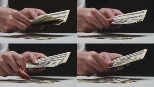 在黑色背景下数美国百元钞票高清在线视频素材下载