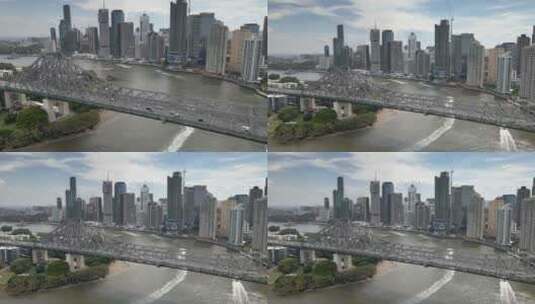 空中4k城市景观桥布里斯班白天揭示河城向后移动高清在线视频素材下载