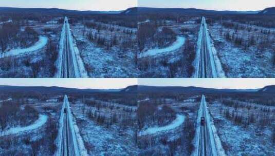 冬季湿地雪景荒野暮色道路汽车行驶高清在线视频素材下载