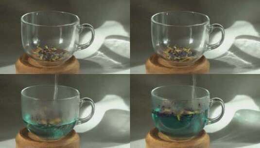 用杯子冲泡安禅蓝茶将沸水倒入装有茶叶的玻高清在线视频素材下载