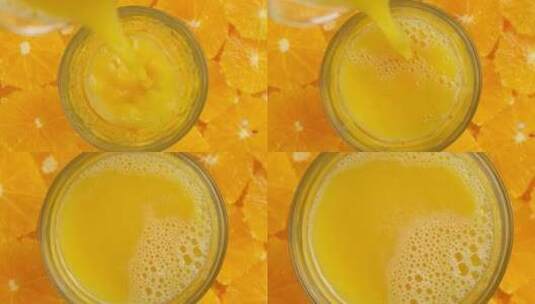 将新鲜的橙汁倒入杯中橘汁鲜榨果汁橙子汁高清在线视频素材下载