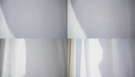 风吹窗帘窗户白色窗帘飘动阳光透过白色窗帘高清在线视频素材下载