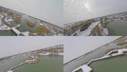 穿越机航拍北湖湿地公园雪景下雪古风建筑高清在线视频素材下载