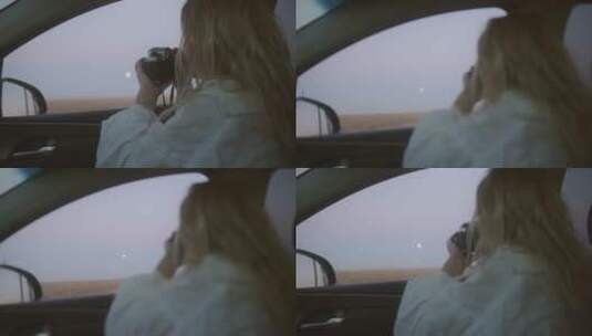 一个女孩拿着相机在车里拍摄高清在线视频素材下载