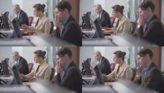 匆忙的女人在办公室和模糊的男人一起工作高清在线视频素材下载