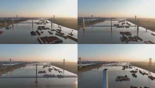 4K航拍夕阳下的洞庭湖桥长江入江口货轮高清在线视频素材下载