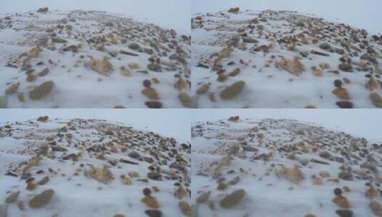 山丘乱石滩飞雪高清在线视频素材下载