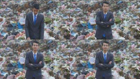 亚洲商人，背景是堆积如山的垃圾高清在线视频素材下载