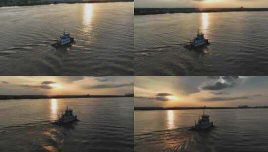 日落时分密西西比河上一艘推船的鸟瞰图高清在线视频素材下载