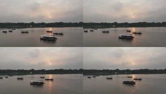 杭州西湖日出时分 泛舟湖上 摇橹船高清在线视频素材下载