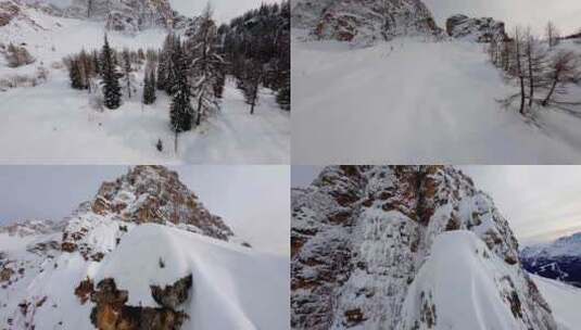 FPV穿越机无人机航拍雪山森林雪景树林白云高清在线视频素材下载