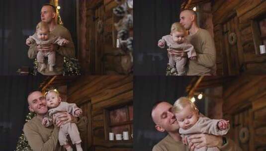 爸爸手里抱着一个小婴儿。父亲和婴儿儿子在高清在线视频素材下载