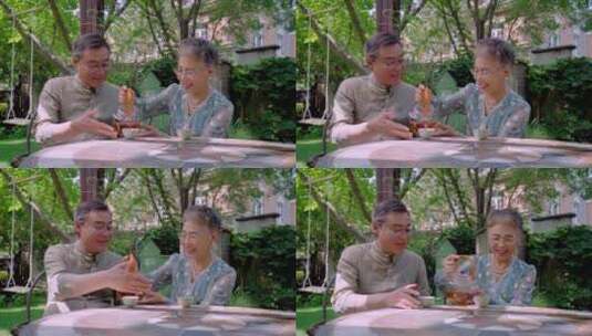 老年夫妇坐在院子里喝茶高清在线视频素材下载