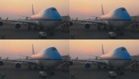 日出时分，飞机747停在登机口高清在线视频素材下载