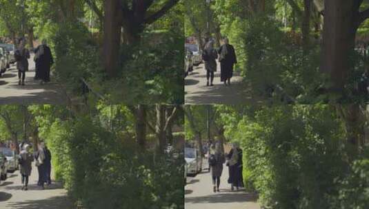 跟踪拍摄两个在街上行走的女人高清在线视频素材下载