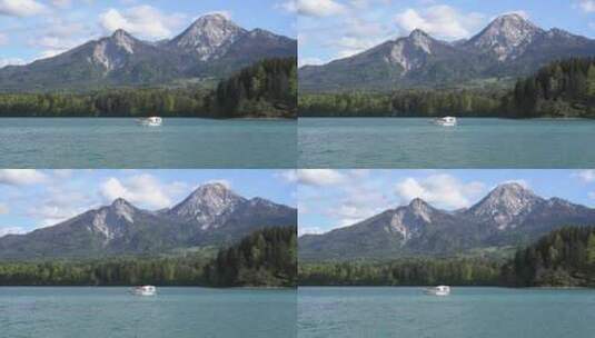 湖中前行的白色的船只高清在线视频素材下载