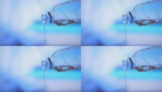 水滴从干净的塑料水瓶中滴落高清在线视频素材下载
