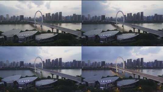 日落延时下的城市桥梁亮灯夜景高清在线视频素材下载