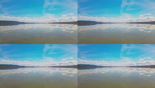 航拍盐湖水天一色水面倒影蓝天白云高清在线视频素材下载