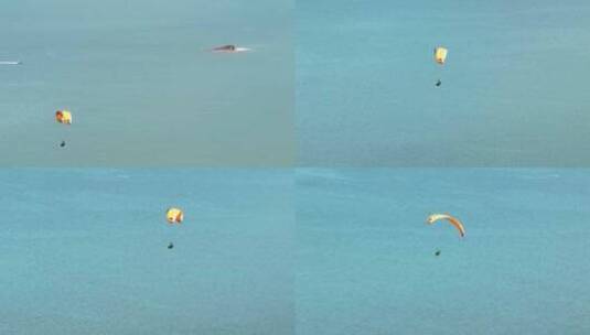 航拍海洋上的极限运动飞翔滑翔伞高清在线视频素材下载