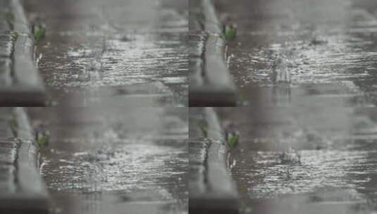 下雨水滴古镇马路牙子积水高清在线视频素材下载