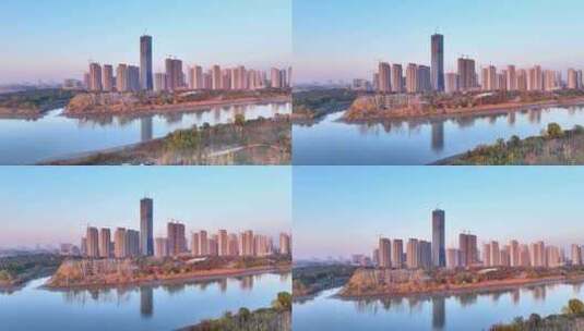 航拍江都金奥中心楼群河流夕阳城市落日建筑高清在线视频素材下载