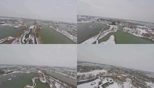 穿越机航拍北湖湿地公园雪景下雪高清在线视频素材下载