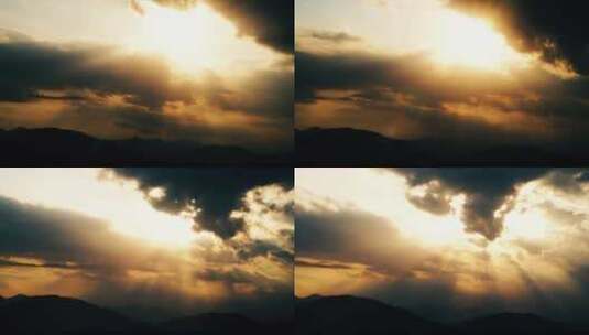 阳光穿透乌云照射山峰丁达尔光延时耶稣光高清在线视频素材下载