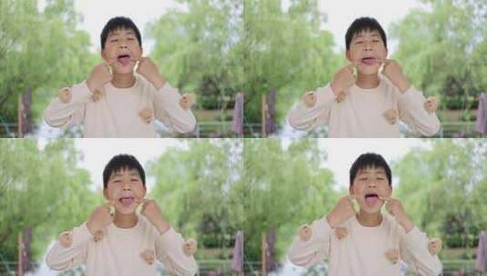 中国小男孩做鬼脸幽默搞笑快乐氛围唯美慢镜高清在线视频素材下载