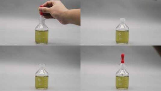 用滴管在滴瓶里吸取黄色溶液高清在线视频素材下载