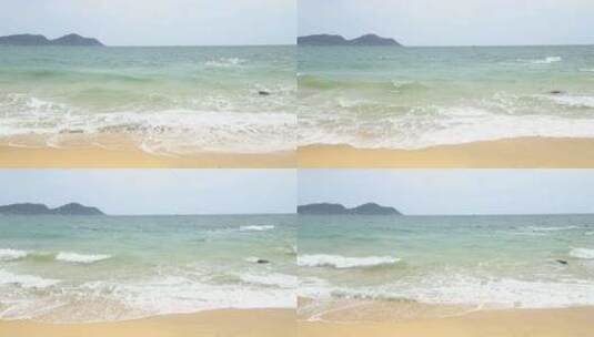 晴天海浪冲刷沙滩高清在线视频素材下载