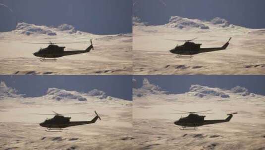 一架直升机飞过白雪覆盖的山脉高清在线视频素材下载