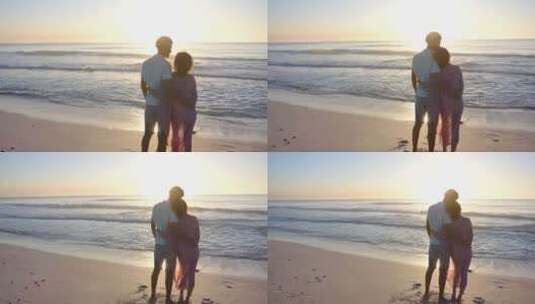 出生夫妇拥抱，剪影在海滩日落与复制空间高清在线视频素材下载
