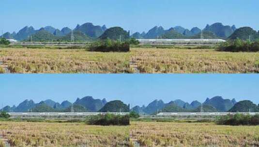 阳光下桂林山边铁路上行驶的高铁动车高清在线视频素材下载